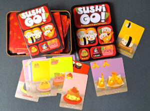 Pudełko i zawartość gry Sushi Go!