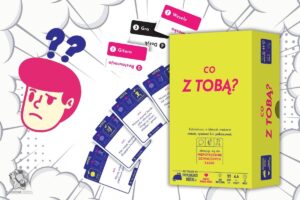 Pudełko gry co z tobą?, w tle komponenty z tej gry czyli karty